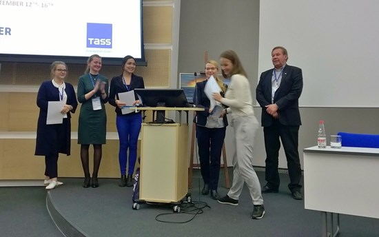 Maria Gostyaeva receiving her Student Award during the closing session of the UArctic Congress 2016. From the left: Student Ambassadors Anastasia Sokolova, Anastasia Chayka and Ulunnquaq Markussen, Research Coordinator Hannele Savela from the UArctic Thematic Networks and Research Liaison Office, and UArctic Vice-President Research Kari Laine.  PHOTO: Kirsi Latola