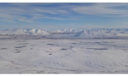 Figure 1. Northern Alaska with a view to the Brooks Range looking south across the tussock tundra landscapes in the foreground.  These tussock tundra systems are becoming snowier and subsequently becoming dominated by shrubs that are leading to greater above and belowground biomass that is being sequester at much higher rates, creating a negative feedback to rising atmospheric CO2 levels (DeFranco et al. 2020)