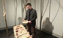 Antti Stöckell presenting his installation: Drowning Ground - Hukkuva maa, 2024.  PHOTO: Mirja Hiltunen