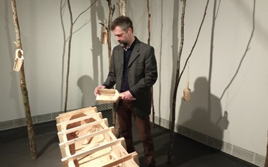 Antti Stöckell presenting his installation: Drowning Ground - Hukkuva maa, 2024.  PHOTO: Mirja Hiltunen