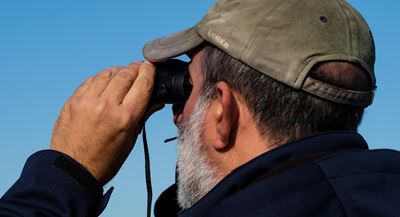 Man With Binoculars PHOTO: Weronika Murray