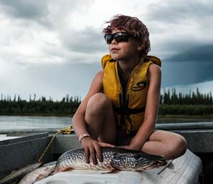 Inuvik Girl Poses For A Photo With A Pike She Caught In The East Branch Of The Mackenzie River Delta  PHOTO: Weronika Murray
