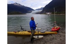 Court Pegus tests a Phantom 4 drone with Mendenhall Glacier in the background. Pontoon stabilizers were added to his kayak to help it serve as a drone launching pad  PHOTO: Court Pegus